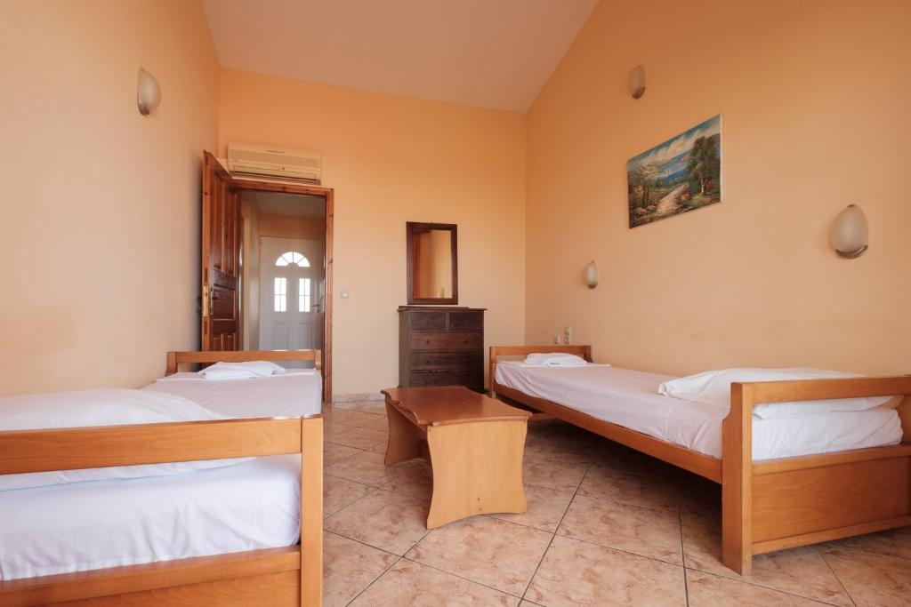 Postel nebo postele na pokoji v ubytování LUISA HOTEL