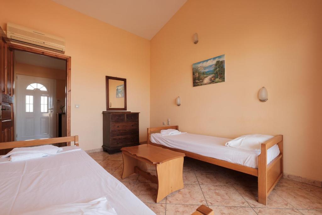 Postel nebo postele na pokoji v ubytování LUISA HOTEL