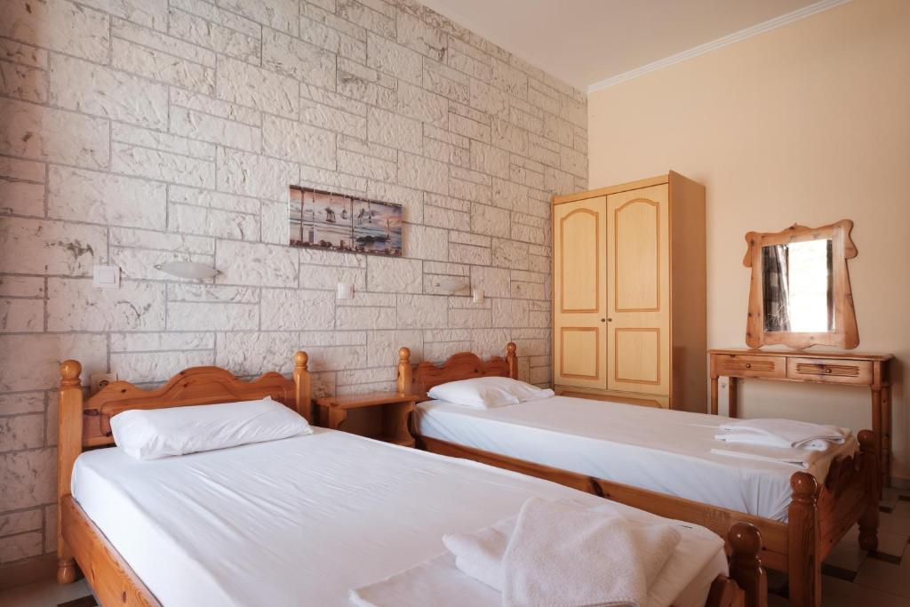 Postel nebo postele na pokoji v ubytování LUISA HOTEL
