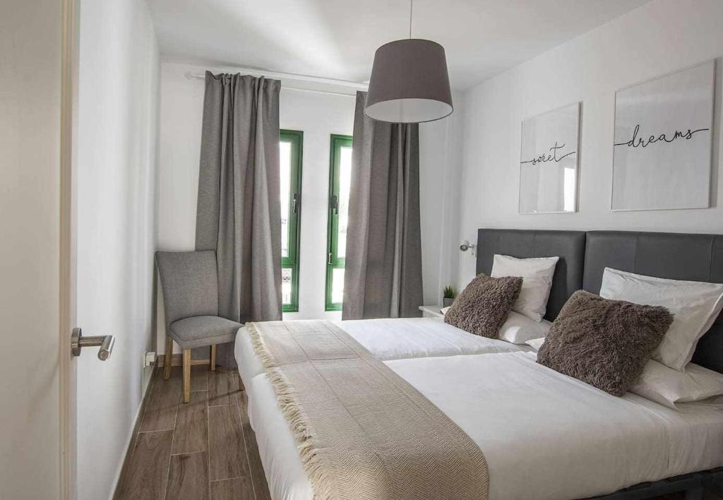 Posteľ alebo postele v izbe v ubytovaní Holyhome grey 104