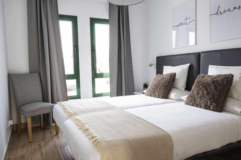 Posteľ alebo postele v izbe v ubytovaní Holyhome grey 104
