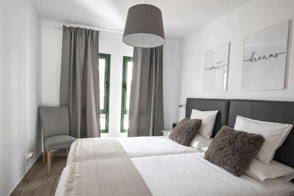 Posteľ alebo postele v izbe v ubytovaní Holyhome grey 104
