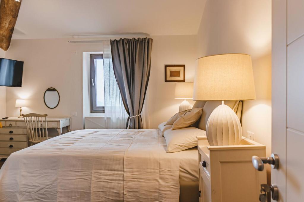 Postel nebo postele na pokoji v ubytování Agriturismo Le Fonti