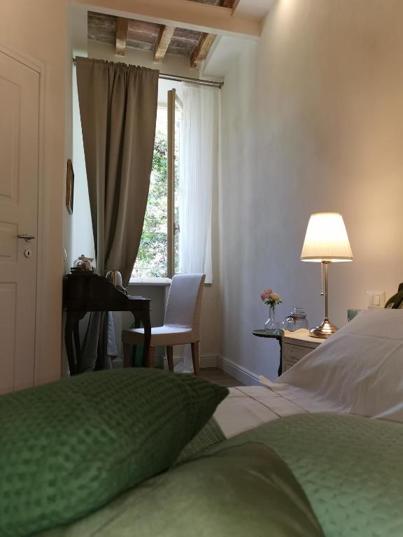 Postel nebo postele na pokoji v ubytování AriediParma - Rooms&apartments