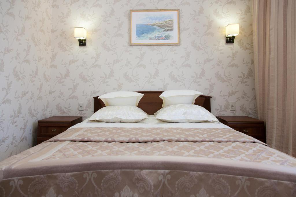 Кровать или кровати в номере Отель Высотник