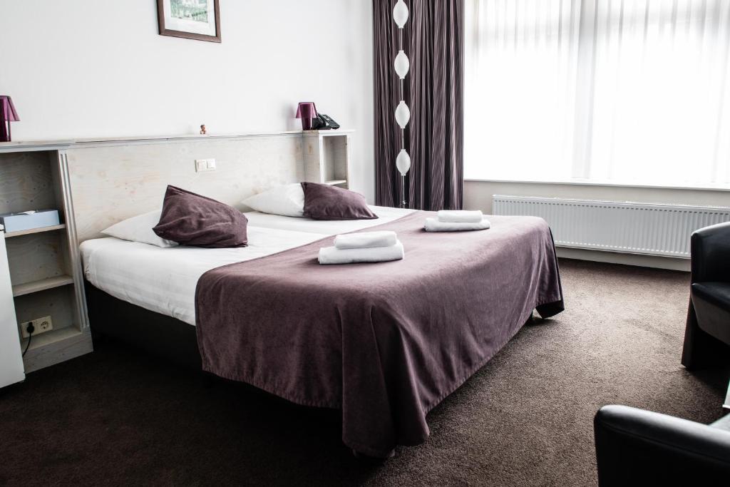 Postel nebo postele na pokoji v ubytování Hotel de Gaaper