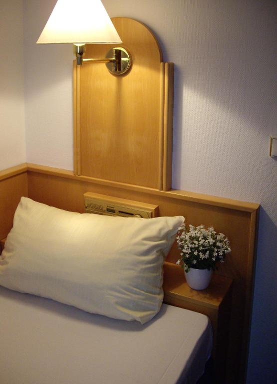 Postel nebo postele na pokoji v ubytování Rußmann Hotel & Living