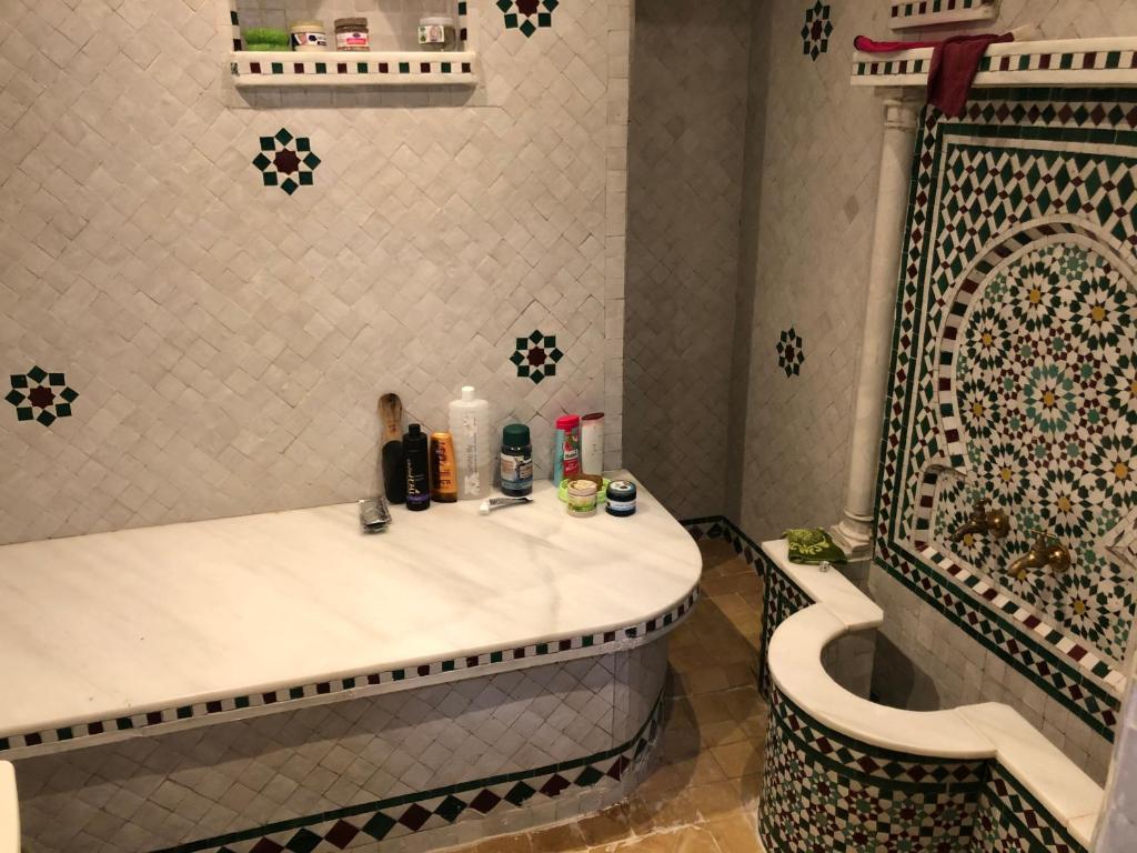 a bathroom with a sink and a toilet and a tub at Apartment Nazaha for families only in Tangier