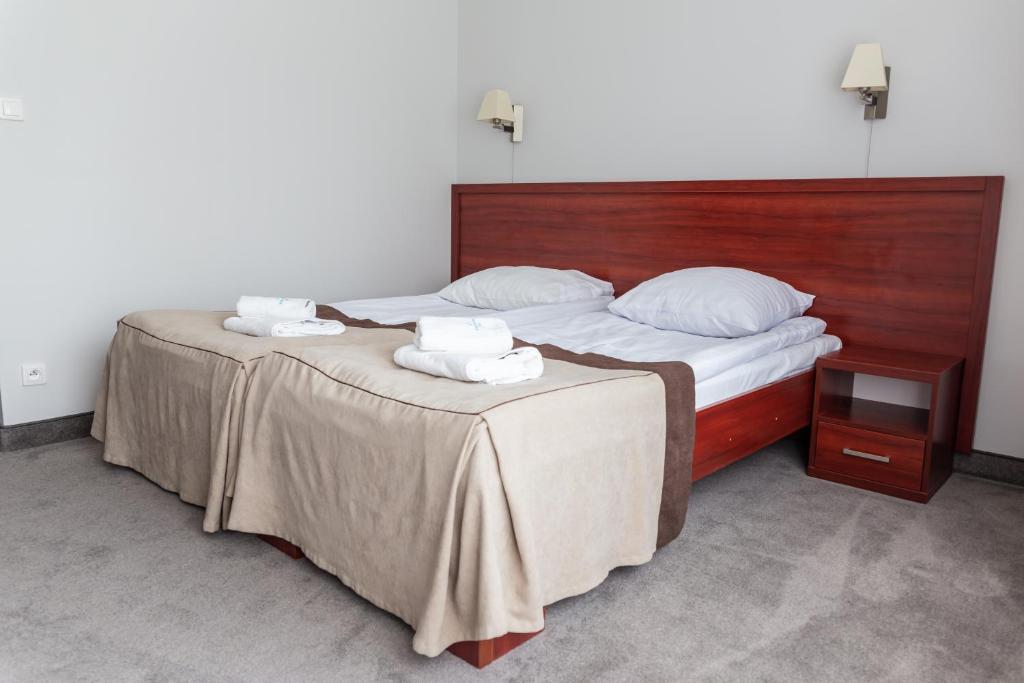 Posteľ alebo postele v izbe v ubytovaní POŁONINY Resort