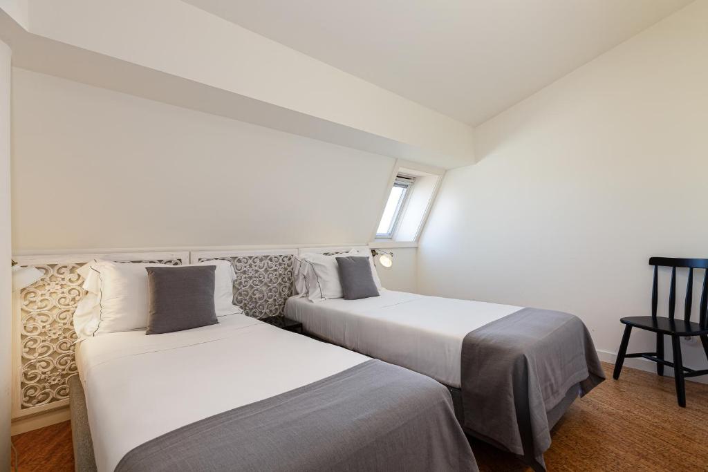 Letto o letti in una camera di Galerias Nightlife Fashion Flats