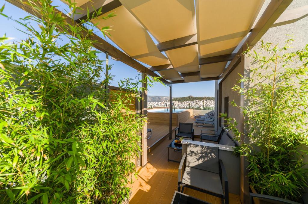 an outdoor balcony with plants on a house at Athens Panorama Project in Athens