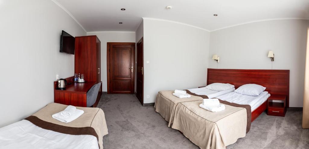 Posteľ alebo postele v izbe v ubytovaní POŁONINY Resort