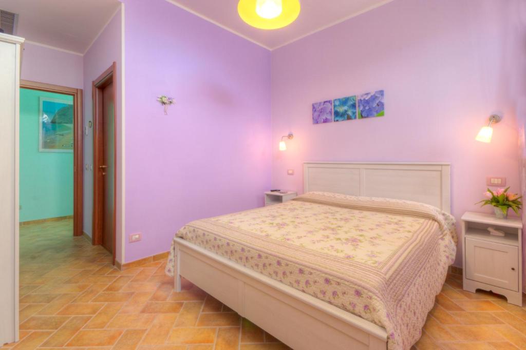 Postel nebo postele na pokoji v ubytování Locanda Del Picchio
