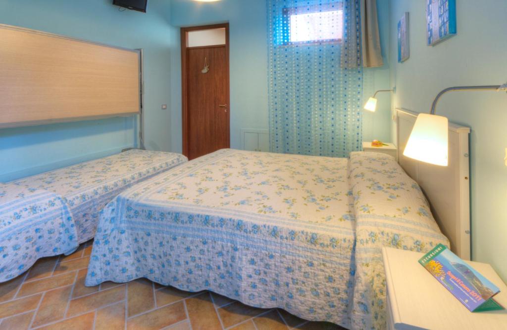 Postel nebo postele na pokoji v ubytování Locanda Del Picchio
