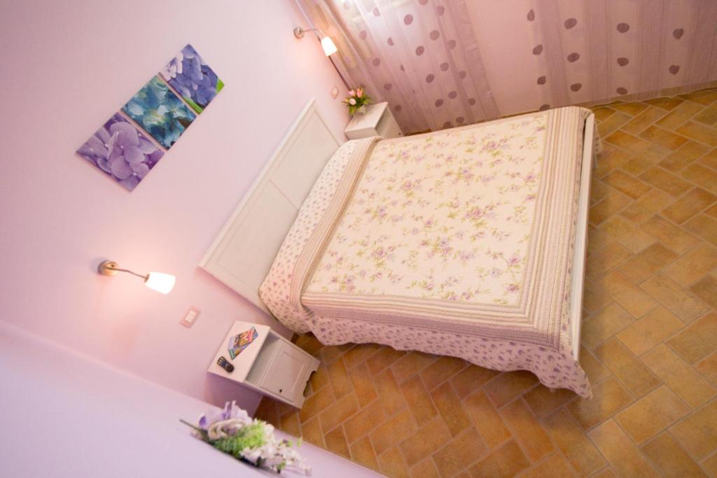 Postel nebo postele na pokoji v ubytování Locanda Del Picchio