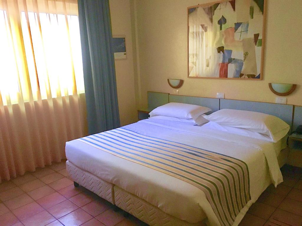 Postel nebo postele na pokoji v ubytování Hotel Ping Pong