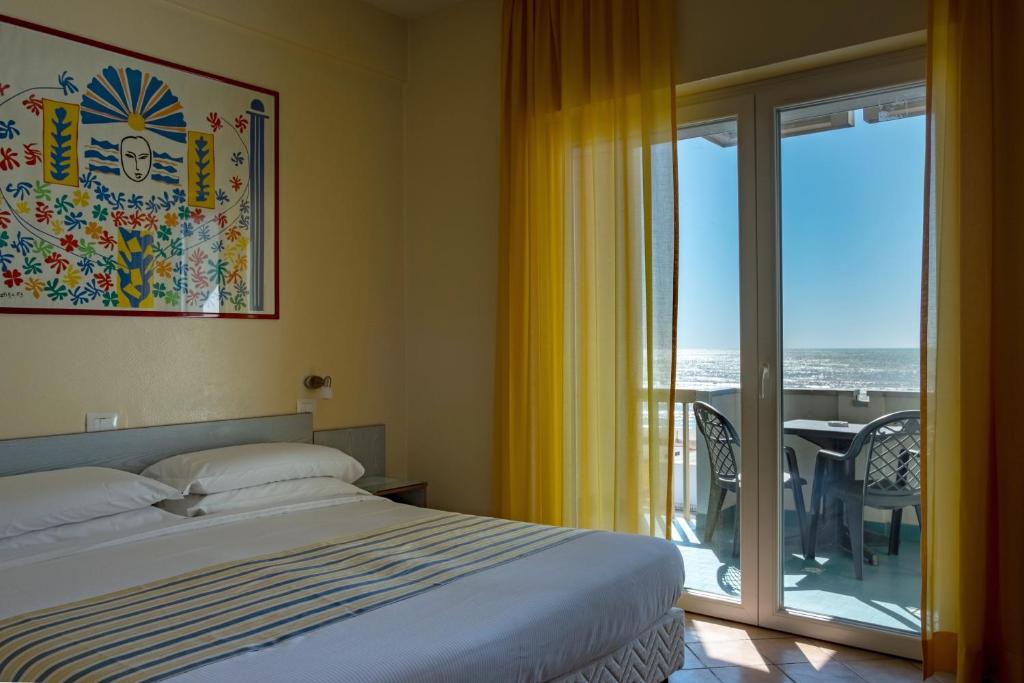 Postel nebo postele na pokoji v ubytování Hotel Ping Pong