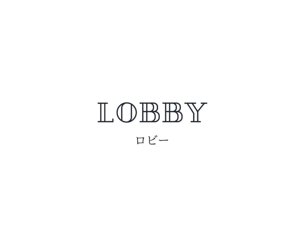 un logo di una società con un logo rosa di Iso Tokei - Vacation STAY 61898v a Kanayama