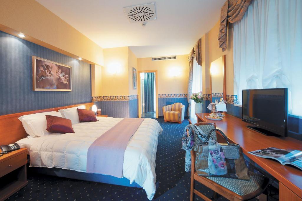 Postel nebo postele na pokoji v ubytování Ele Green Park Hotel Pamphili