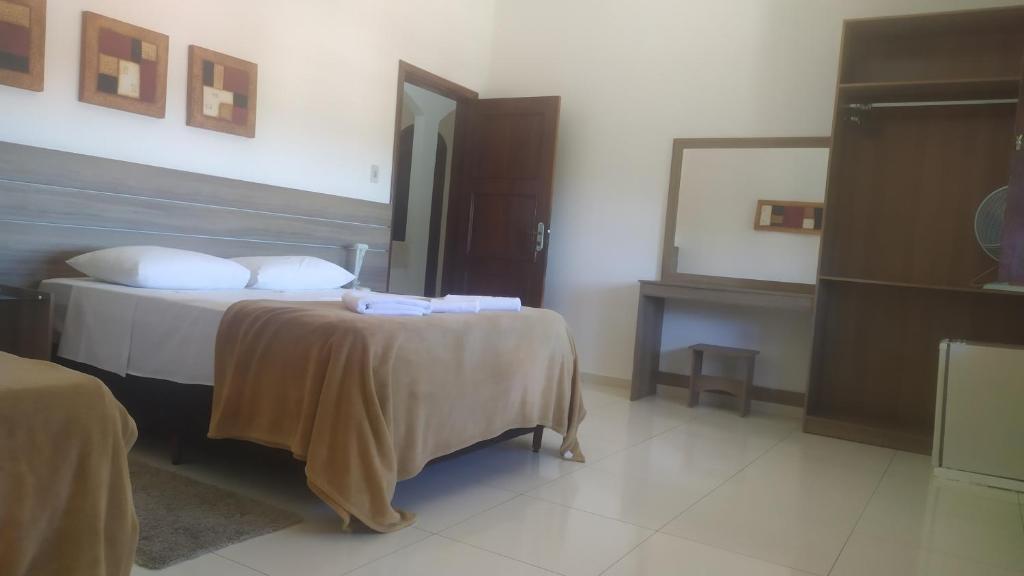 Casa Hospedagem Diamantina tesisinde bir odada yatak veya yataklar