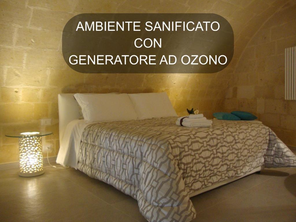 a bedroom with a bed and a sign that says ambulance sanitized at Vivere nei Sassi in Matera