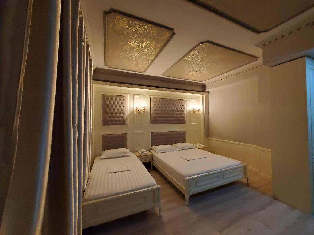 Postel nebo postele na pokoji v ubytování Hotel Lotus
