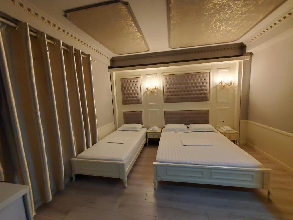 Postel nebo postele na pokoji v ubytování Hotel Lotus