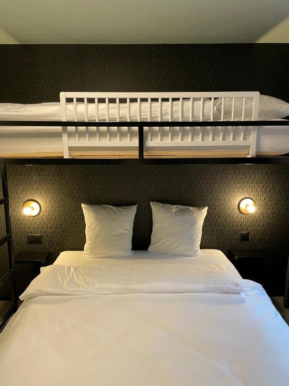 Postel nebo postele na pokoji v ubytování BLOOM Boutique Hotel & Lounge Basel