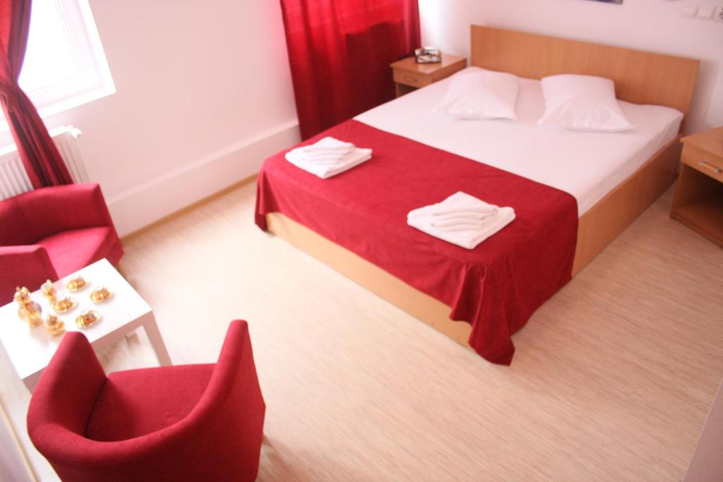 Postel nebo postele na pokoji v ubytování Hotel Sir Gara de Nord