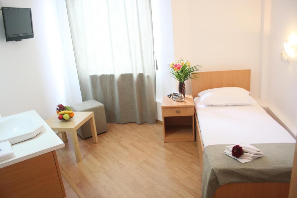 Postel nebo postele na pokoji v ubytování Hotel Sir Gara de Nord
