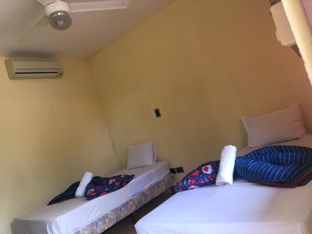 Postel nebo postele na pokoji v ubytování Hotel Real Alaska