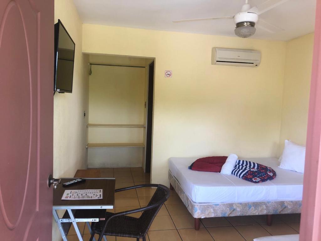 Postel nebo postele na pokoji v ubytování Hotel Real Alaska