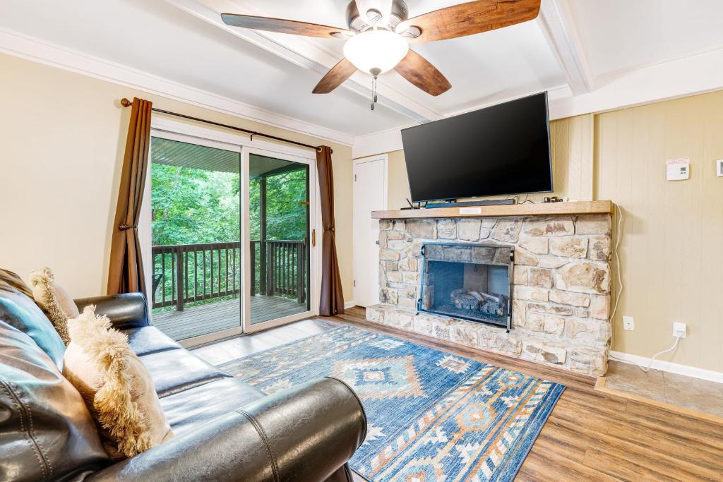 a living room with a couch and a fireplace at Casa Bee Branch in Sugar Mountain