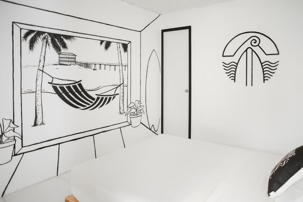 a drawing of a room with a surfboard on the wall at Suyog Life Siargao in General Luna