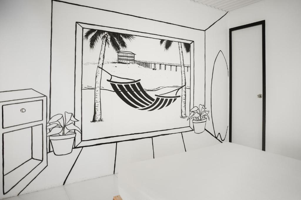 a drawing of a bedroom with a hammock in a window at Suyog Life Siargao in General Luna