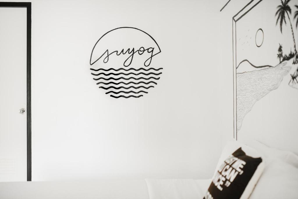 a room with a sign that reads answer at Suyog Life Siargao in General Luna