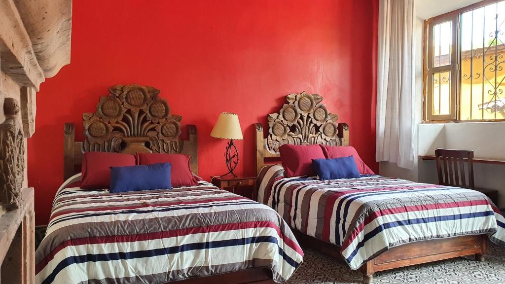Postel nebo postele na pokoji v ubytování Hotel Sautto