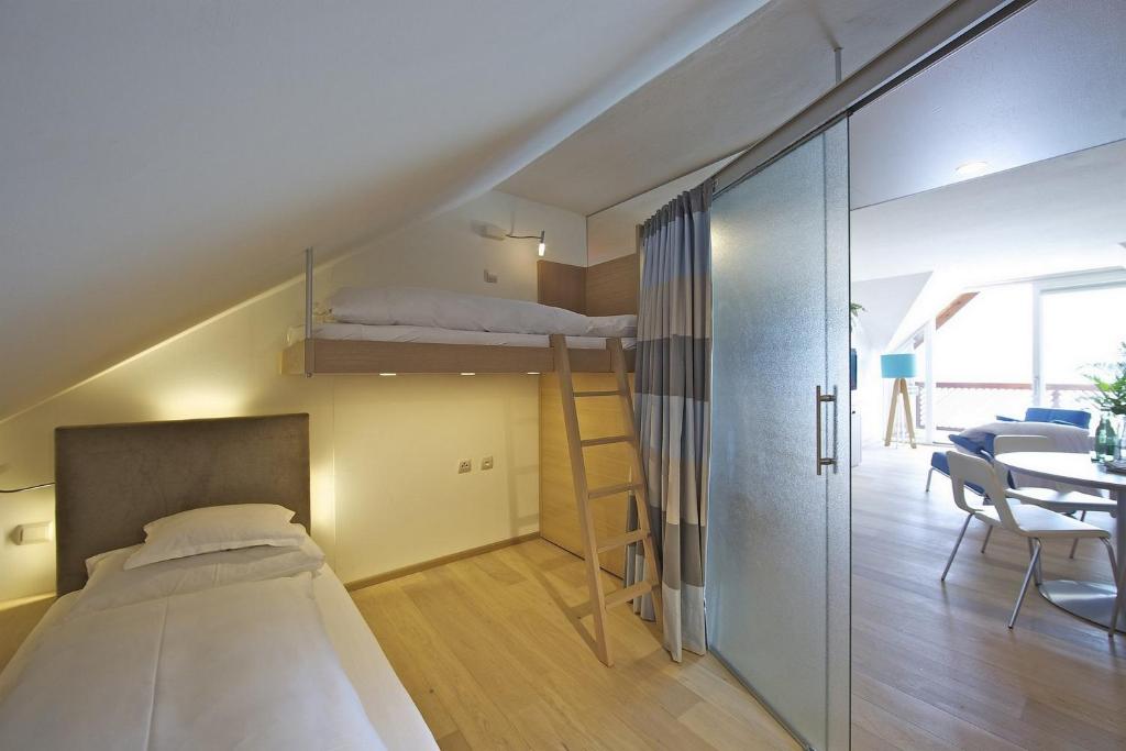 Postel nebo postele na pokoji v ubytování Kleines Hotel Kärnten