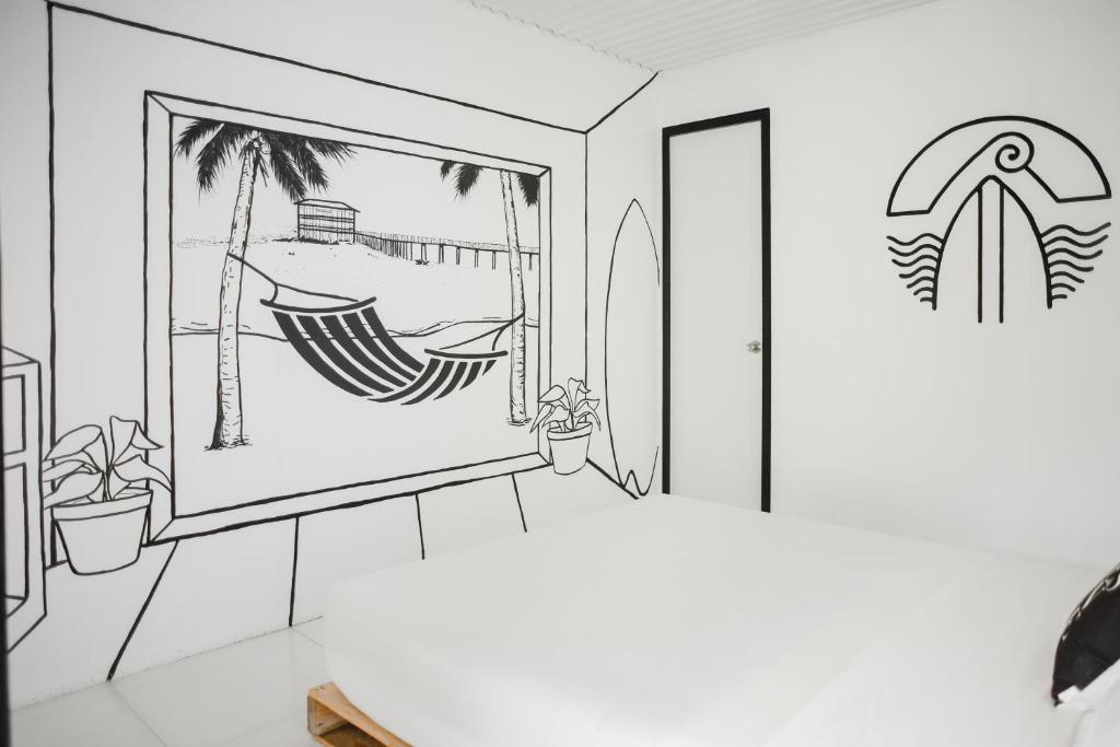 a drawing of a room with a window and a surfboard at Suyog Life Siargao in General Luna