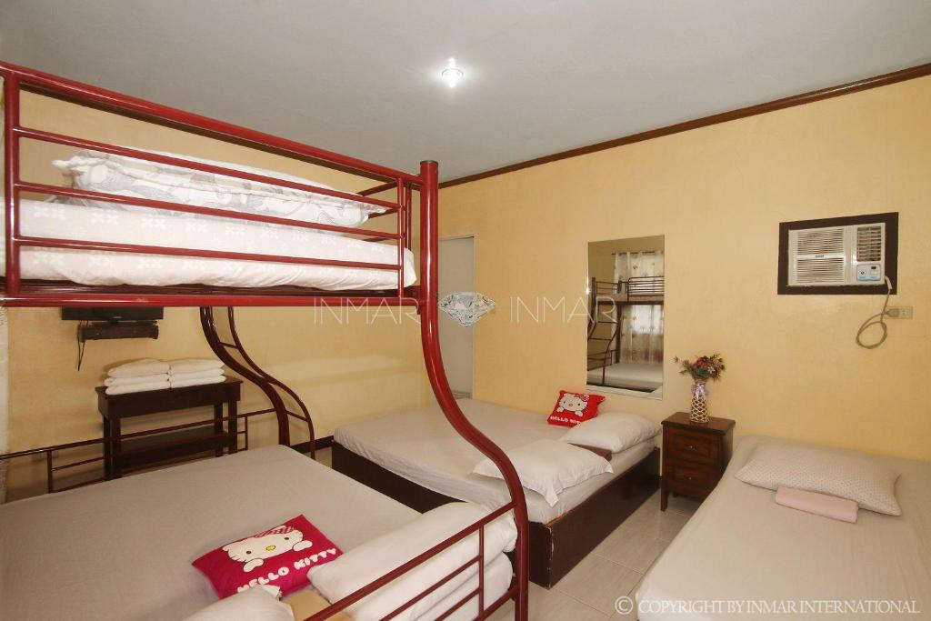 Postel nebo postele na pokoji v ubytování Ana Jean Lodging House