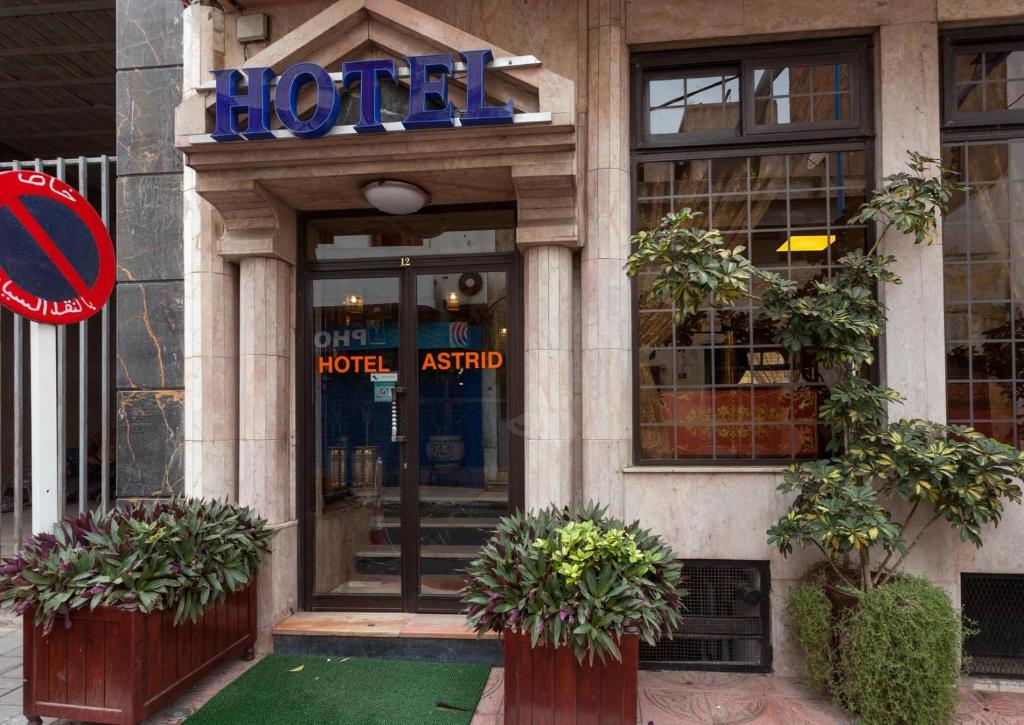 a hotel with a sign on the front of a building at Hôtel Astrid in Casablanca