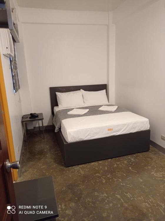 Postel nebo postele na pokoji v ubytování 8 Zhensen Inn