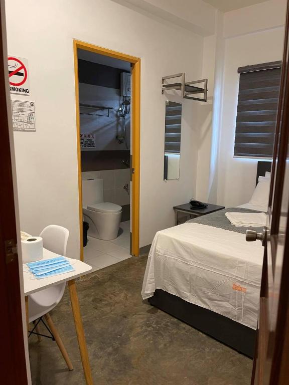 Postel nebo postele na pokoji v ubytování 8 Zhensen Inn