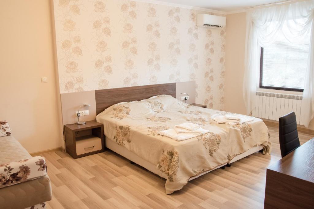 Postel nebo postele na pokoji v ubytování Hotel Fantazia