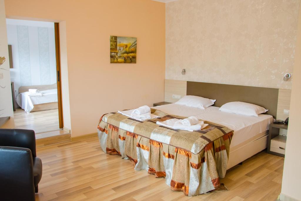 Postel nebo postele na pokoji v ubytování Hotel Fantazia