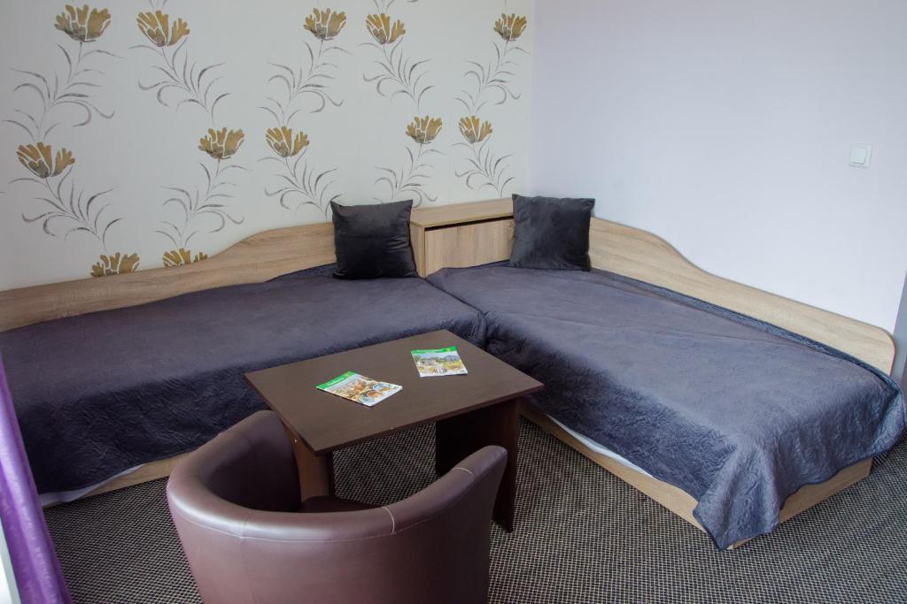 Postel nebo postele na pokoji v ubytování Hotel Fantazia