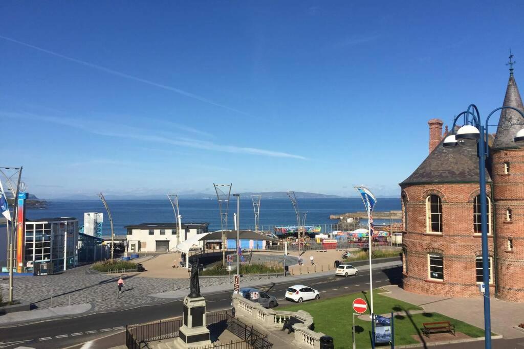 a view of a city with a building and a street at Beautiful Sea view, Entire 2 bed Apartment, Portrush centre West Strand BeachView in Portrush