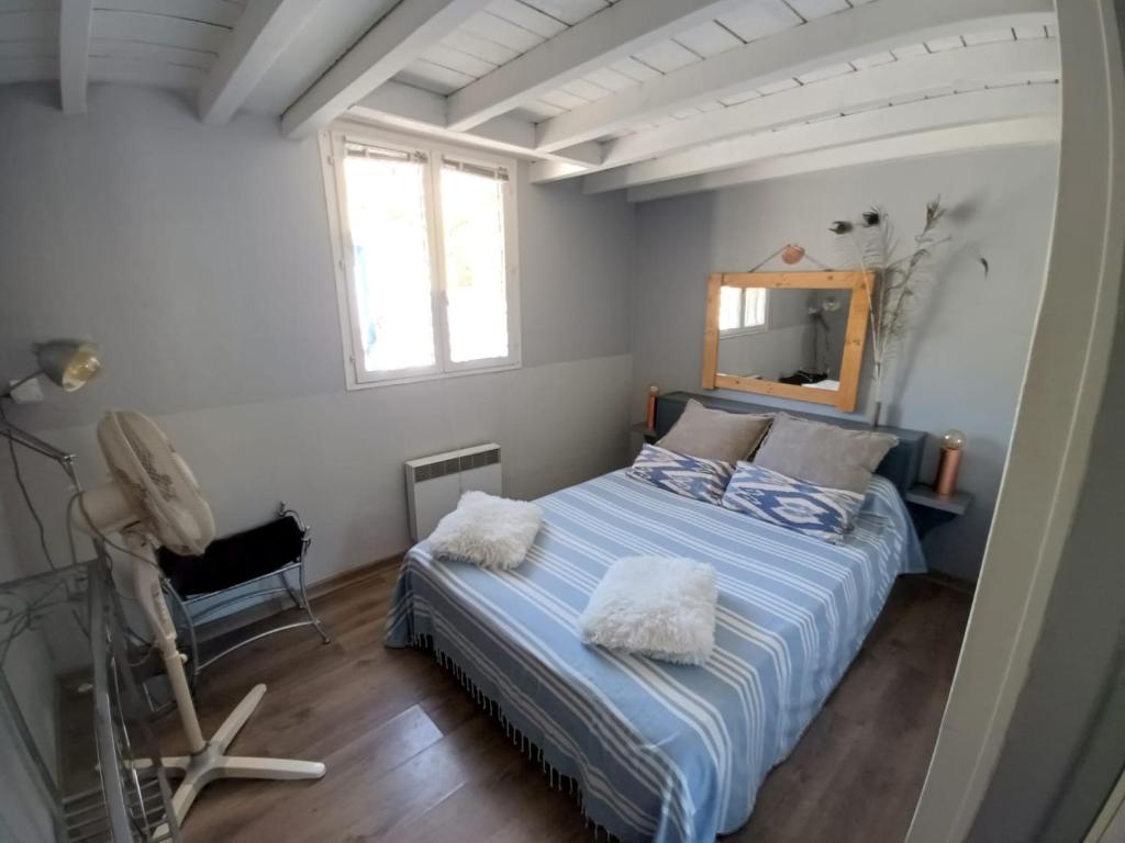 Maison de pecheur tesisinde bir odada yatak veya yataklar