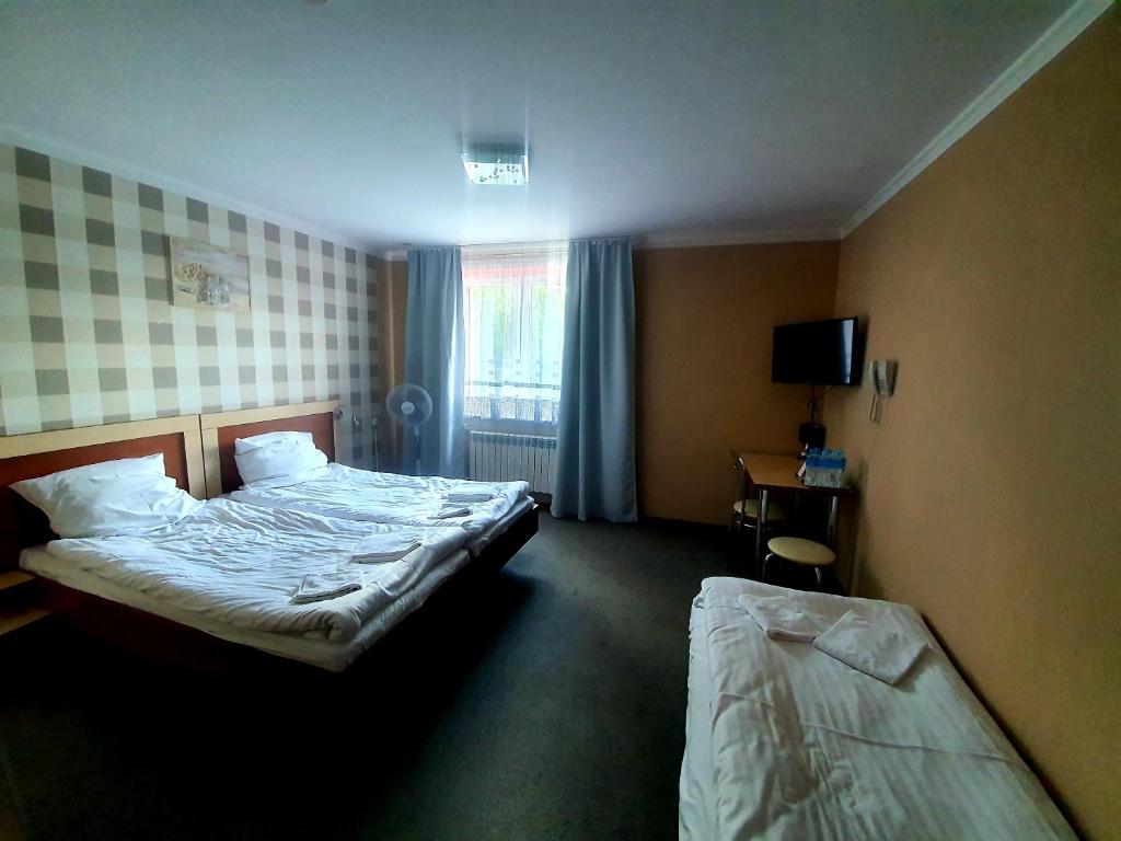 Posteľ alebo postele v izbe v ubytovaní Karczma pod Młynem