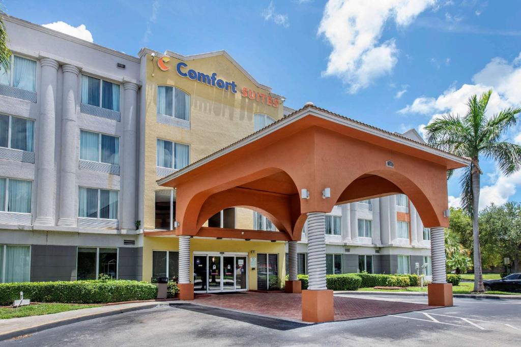 a rendering of a hotel with a large building at Comfort Suites Sawgrass in Tamarac